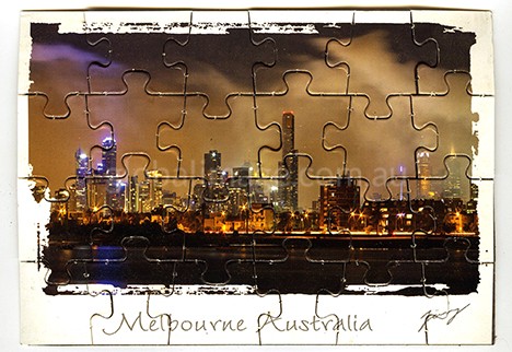 This Melbourne Australia Puzzel Postcard is overlooking Melbourne from St Kilda Pier.